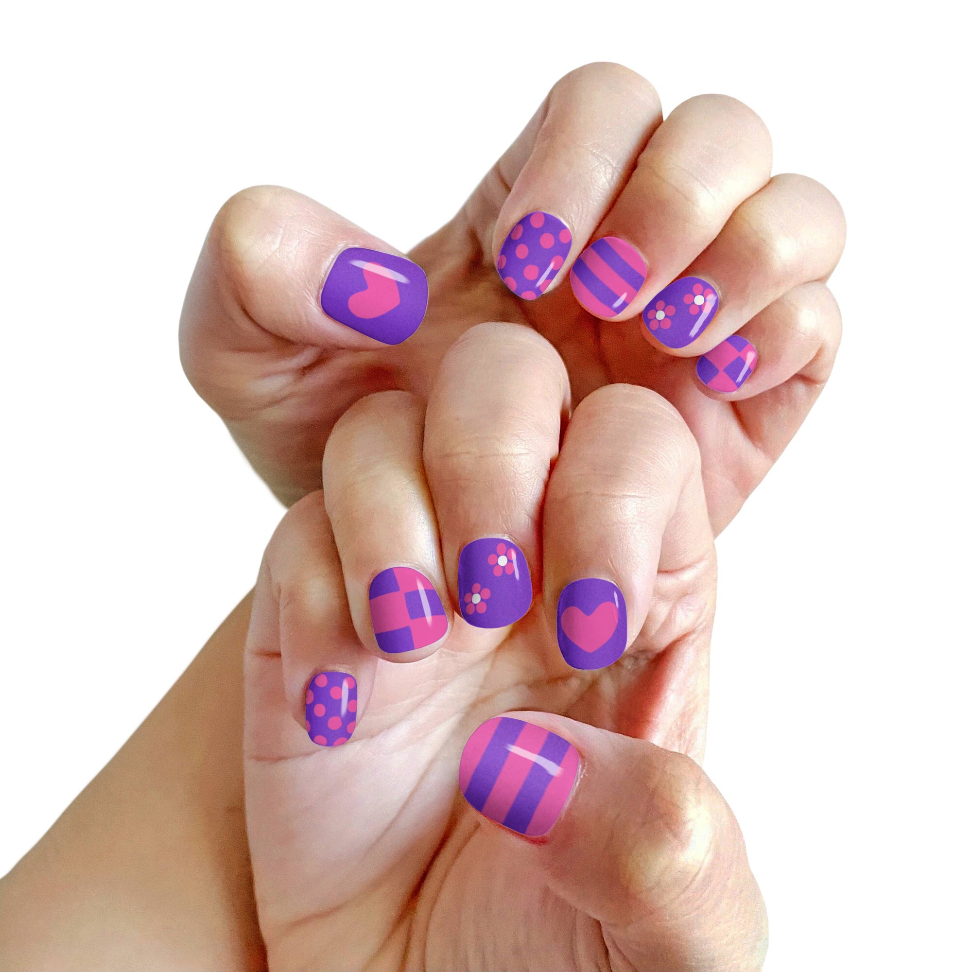 Close-up of hands with colorful nail art on a white background
