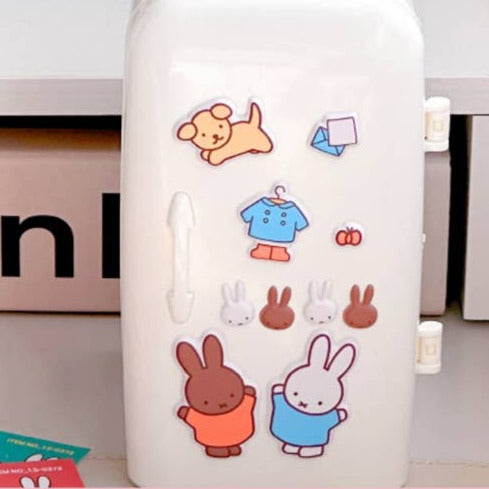 White phone case with cartoon characters on a pink background