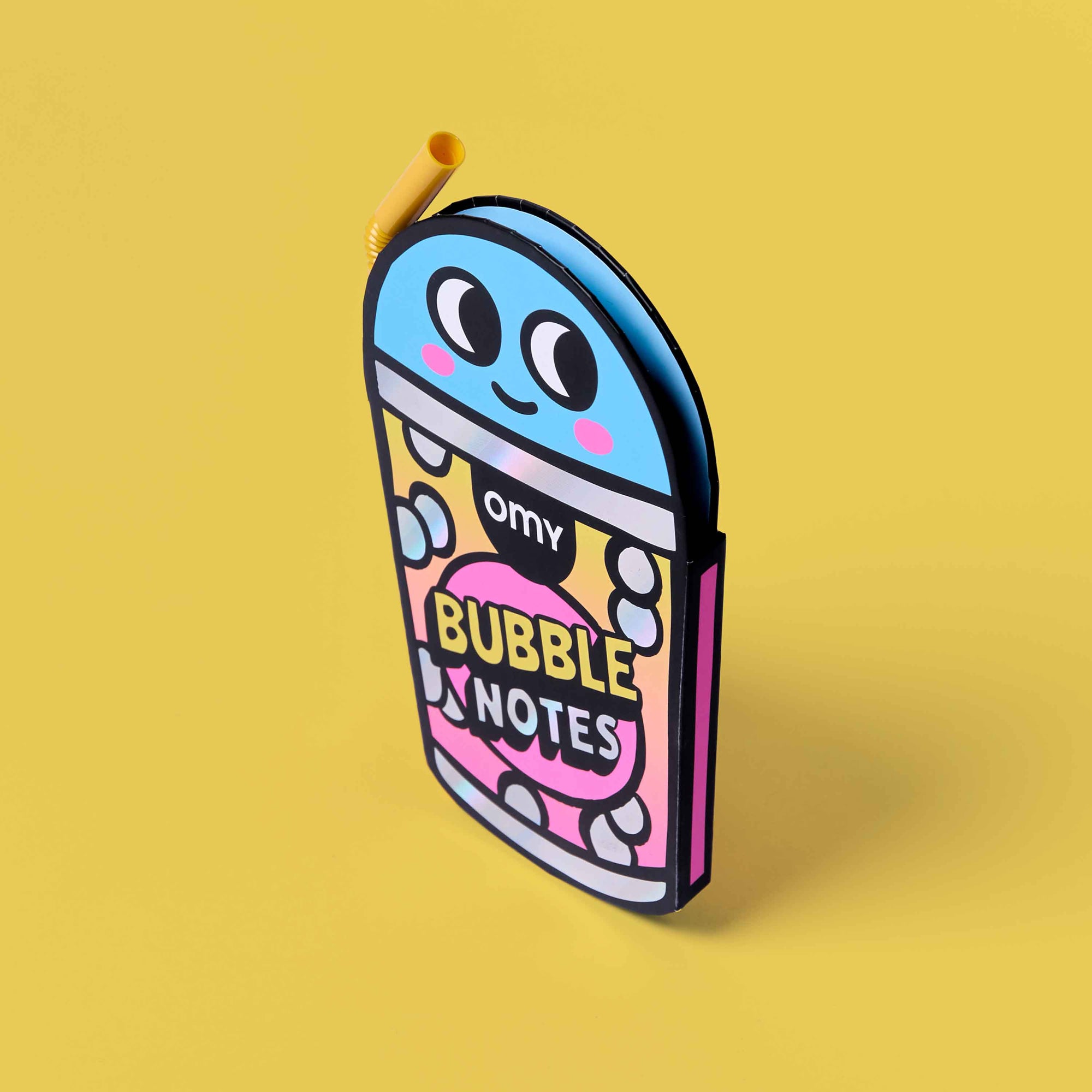 Colorful notebook with cartoon design on a yellow background