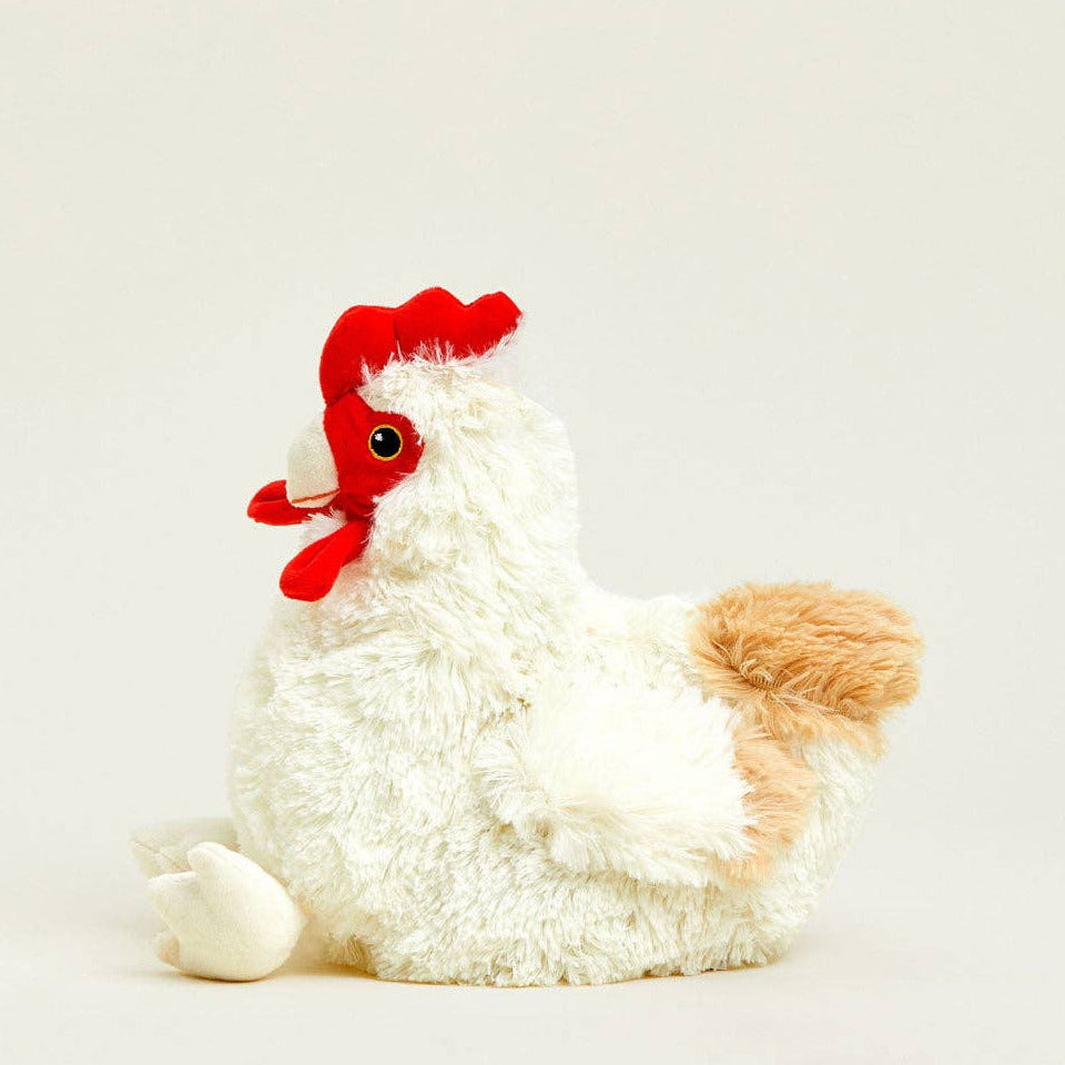 Plush toy rooster with a red comb on a white background
