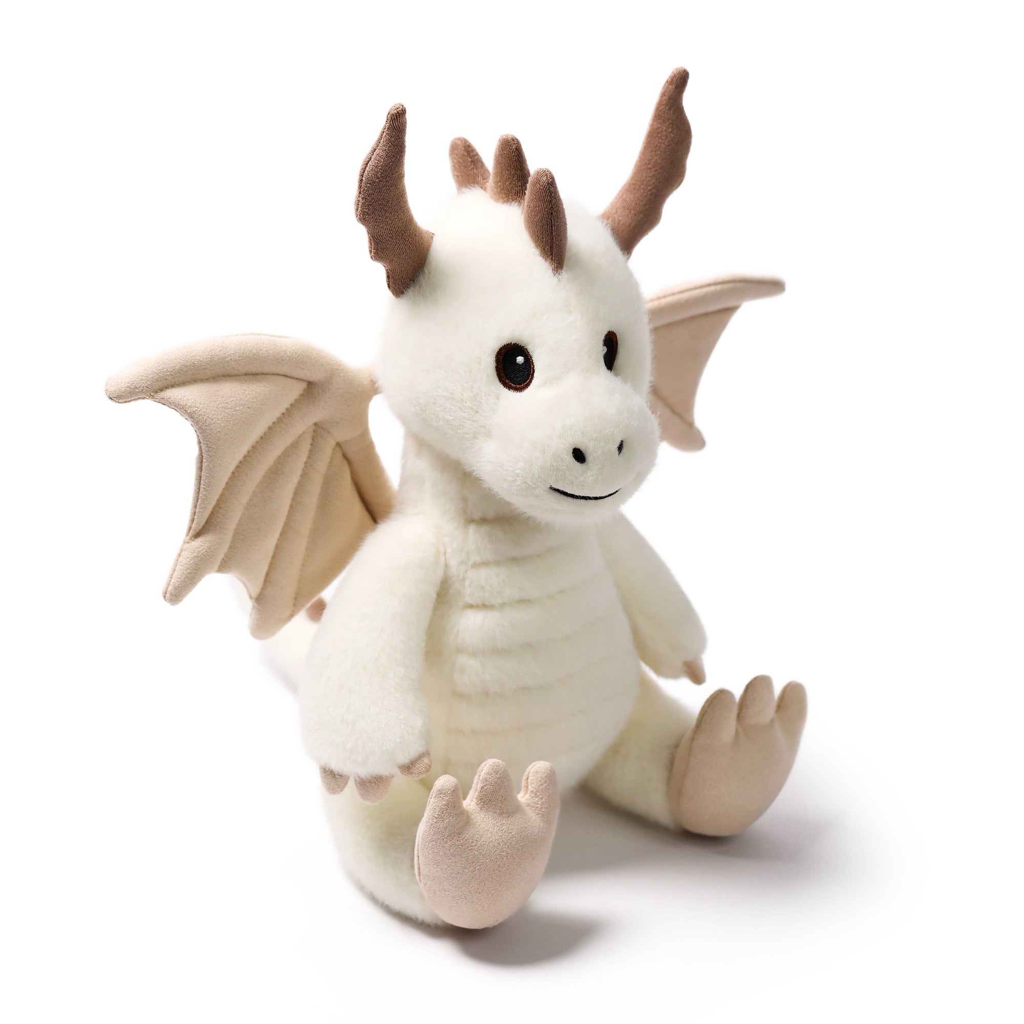 Plush dragon toy with white body, brown wings, and horns on a white background