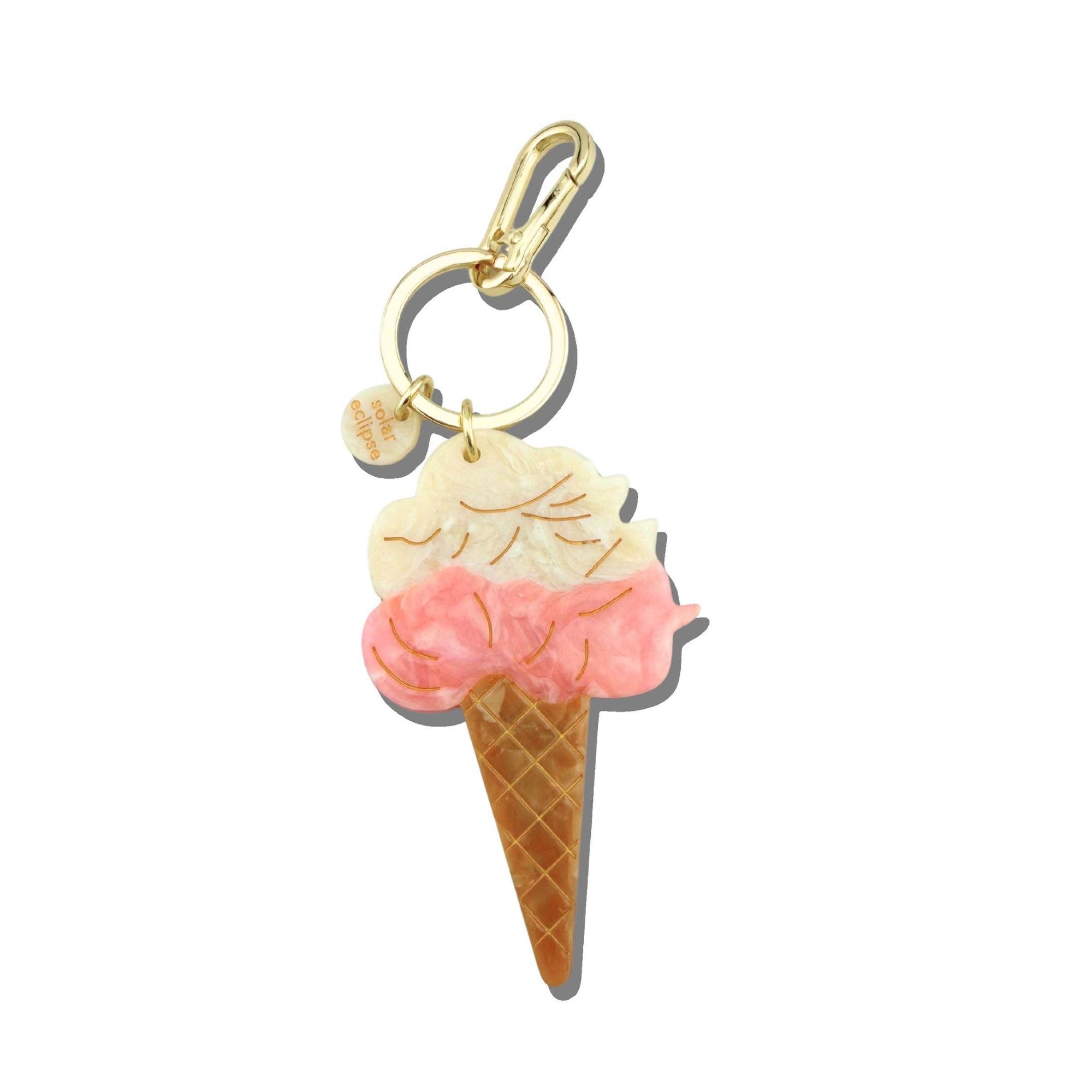 Ice cream cone charm with pink top on a white background