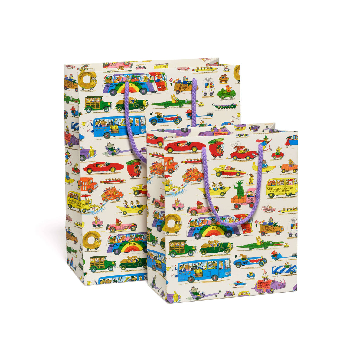 Two gift bags with a colorful cartoon bus pattern on a cream background, featuring purple rope handles, photographed on a clean white background.