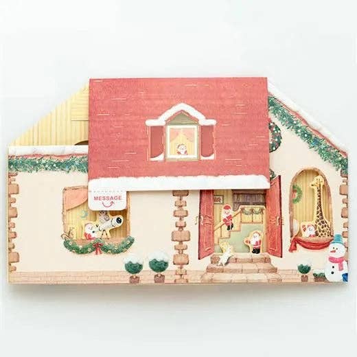 Decorative house-shaped card with Christmas-themed elements on a white background