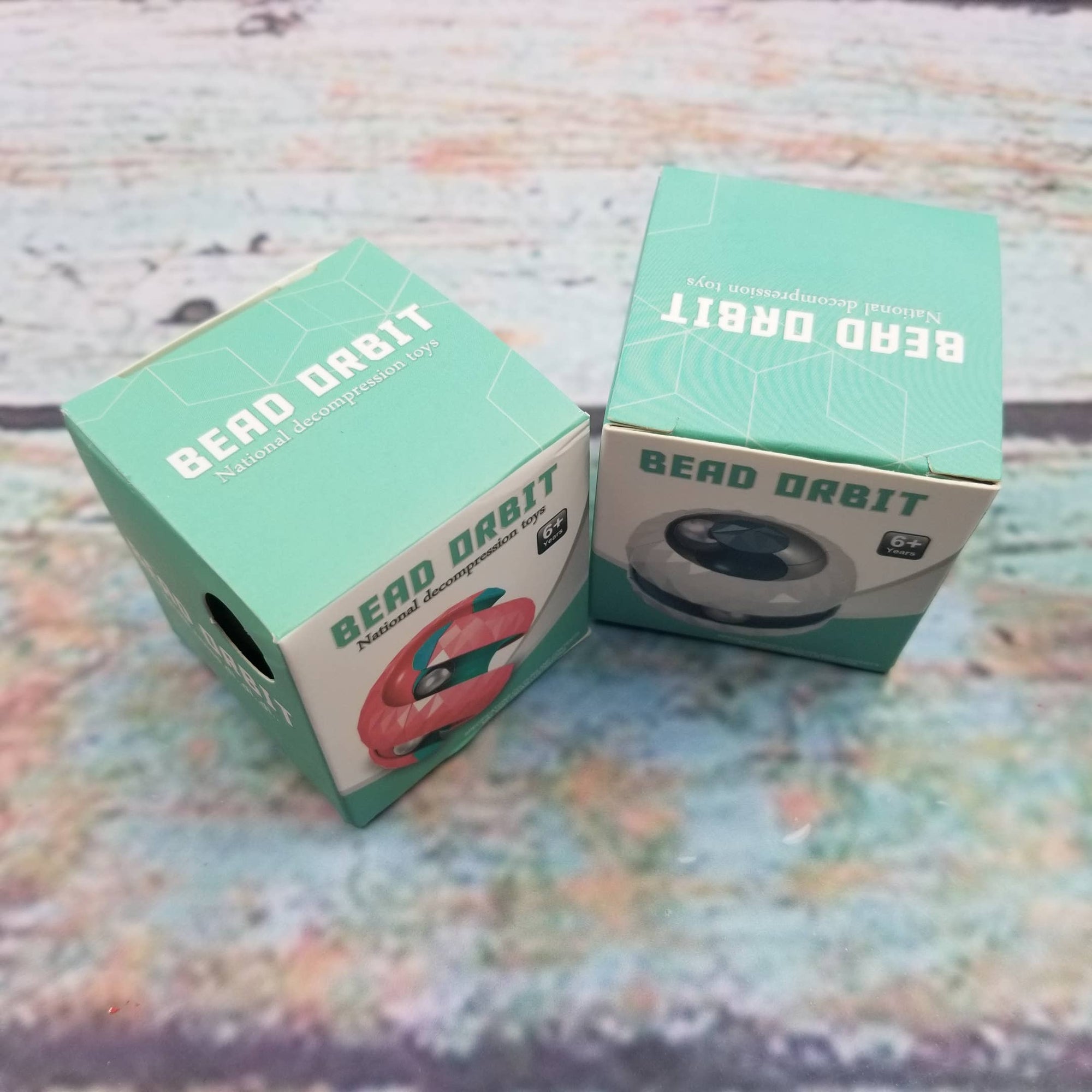 Two green boxes labeled 'Bead Orbit' on a textured surface