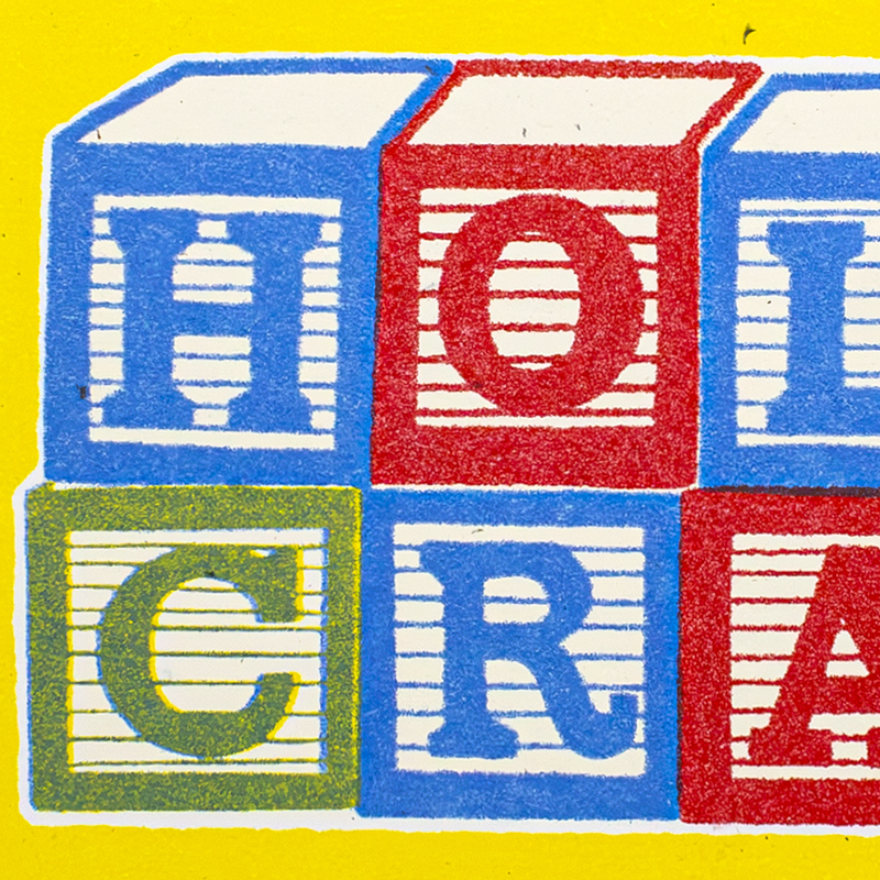 A close-up graphic of colorful toy blocks spelling out the word 'HOT CRAZY' on a bright yellow background.