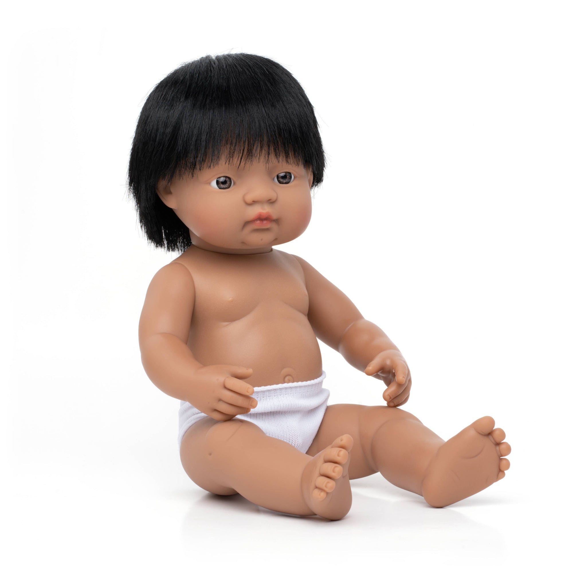 Baby doll with black hair and a diaper on a white background