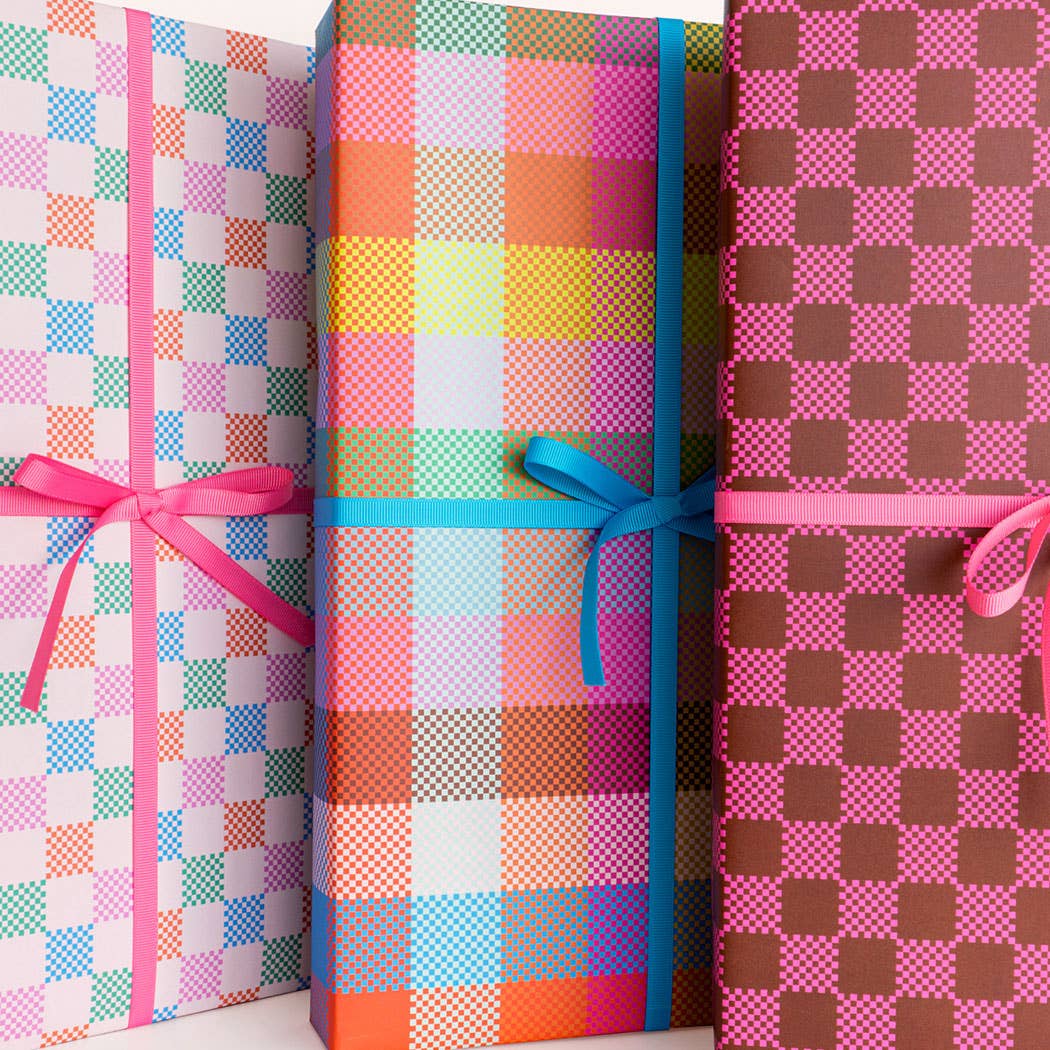 Three wrapped gifts with colorful checkered patterns and ribbons.