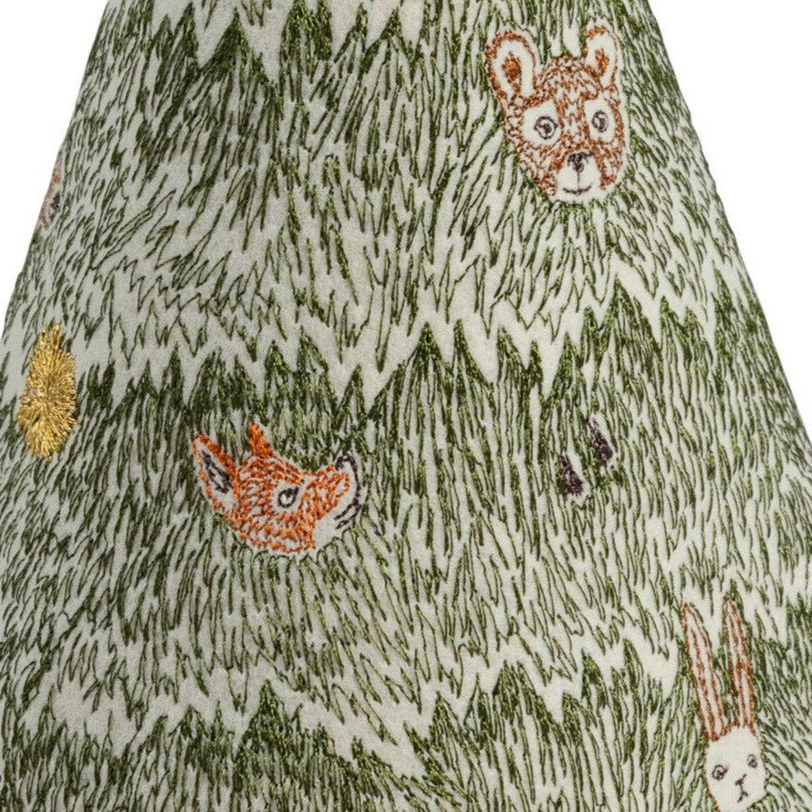 Decorative cone-shaped object with animal patterns on a white background