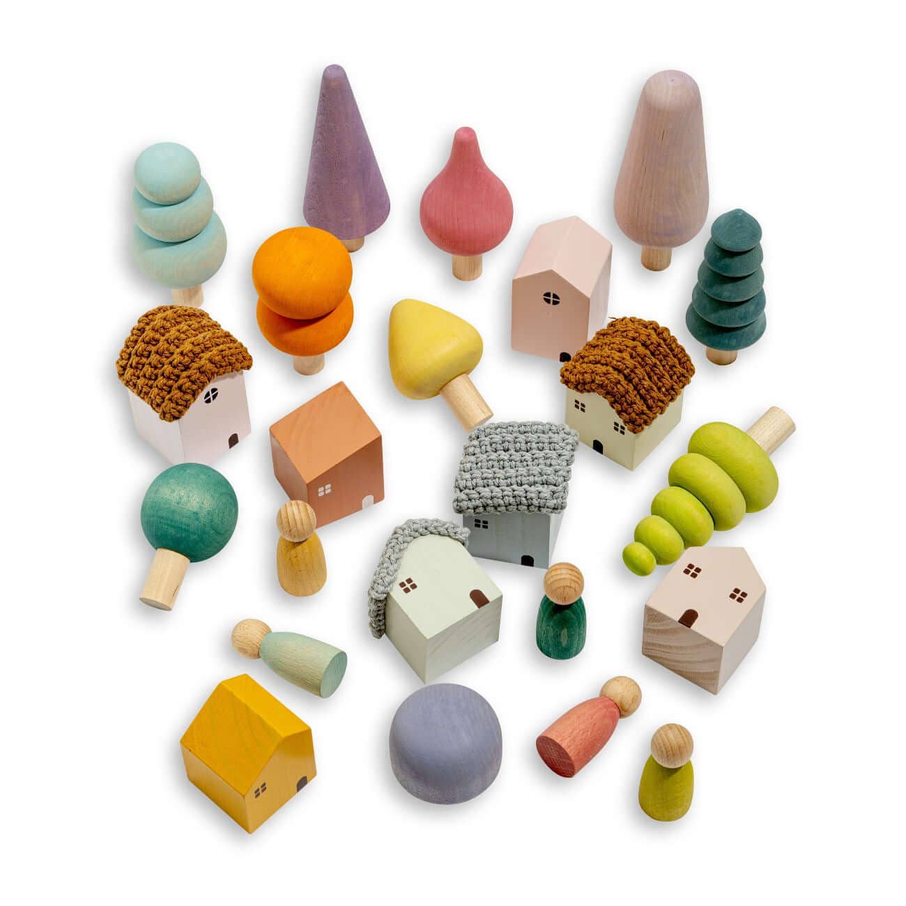 Assorted wooden toys including houses, trees, and people on a white background