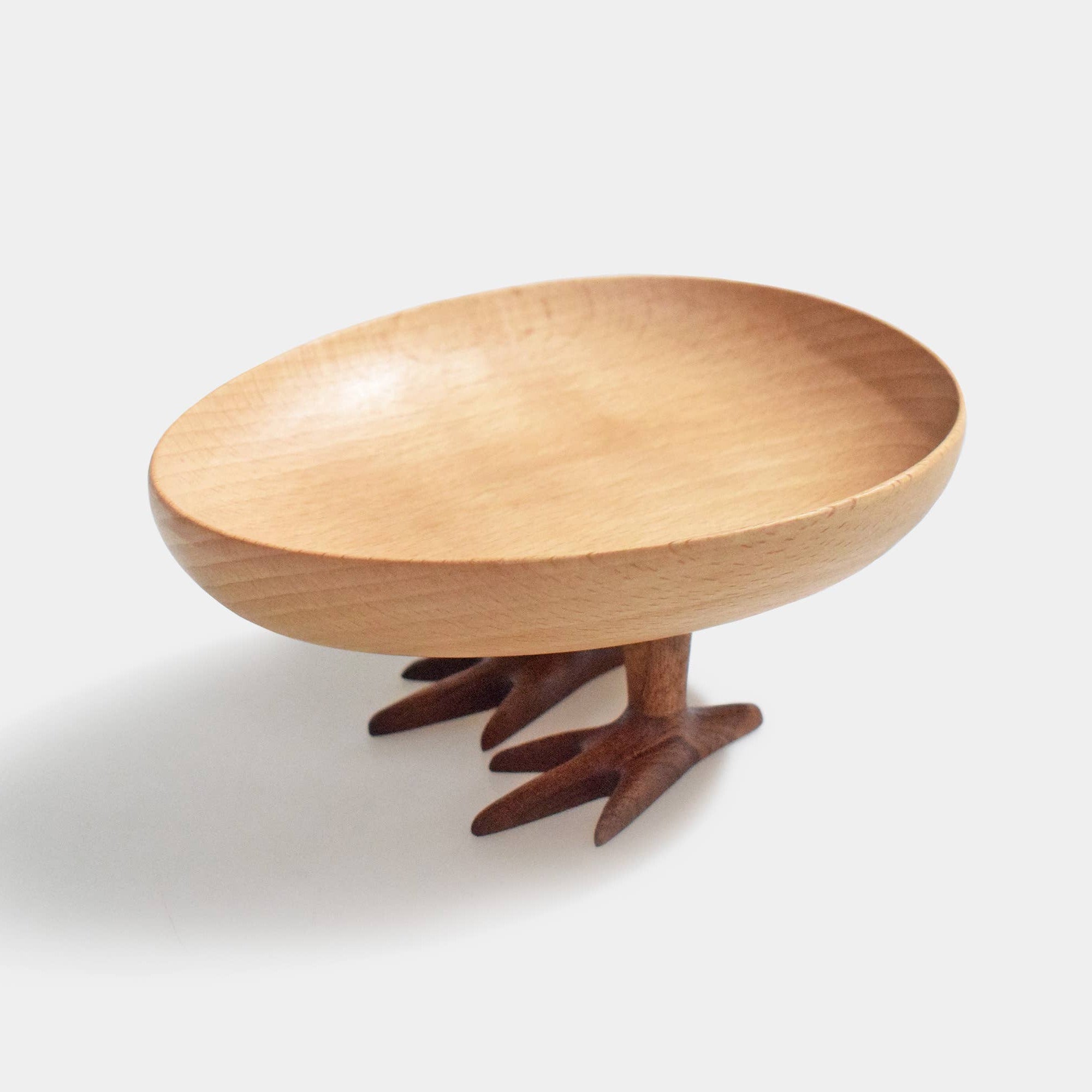 Wooden bowl with a unique design on a white background