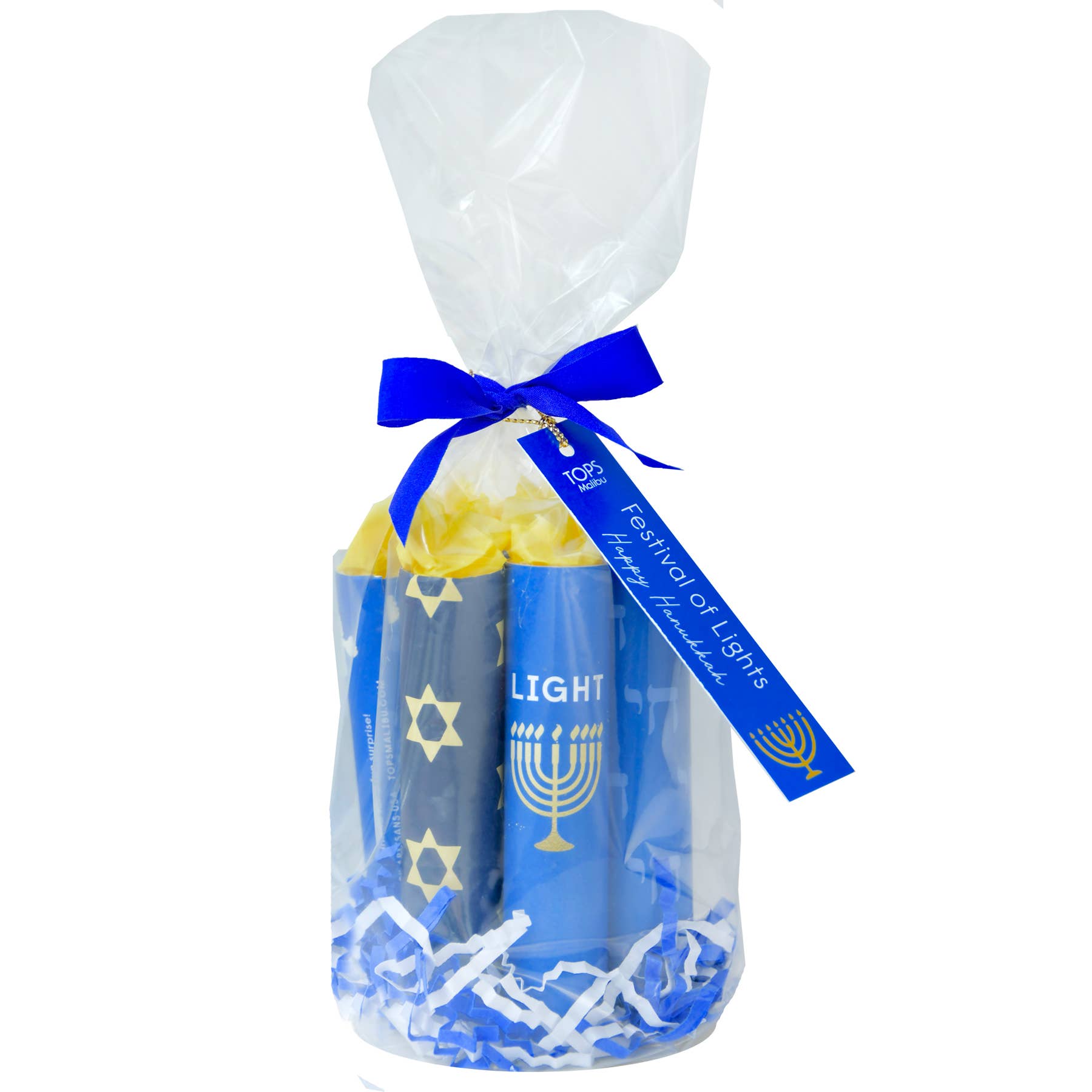 Gift set with candles and a Menorah, wrapped in clear cellophane with a blue ribbon and tag, on a white background.