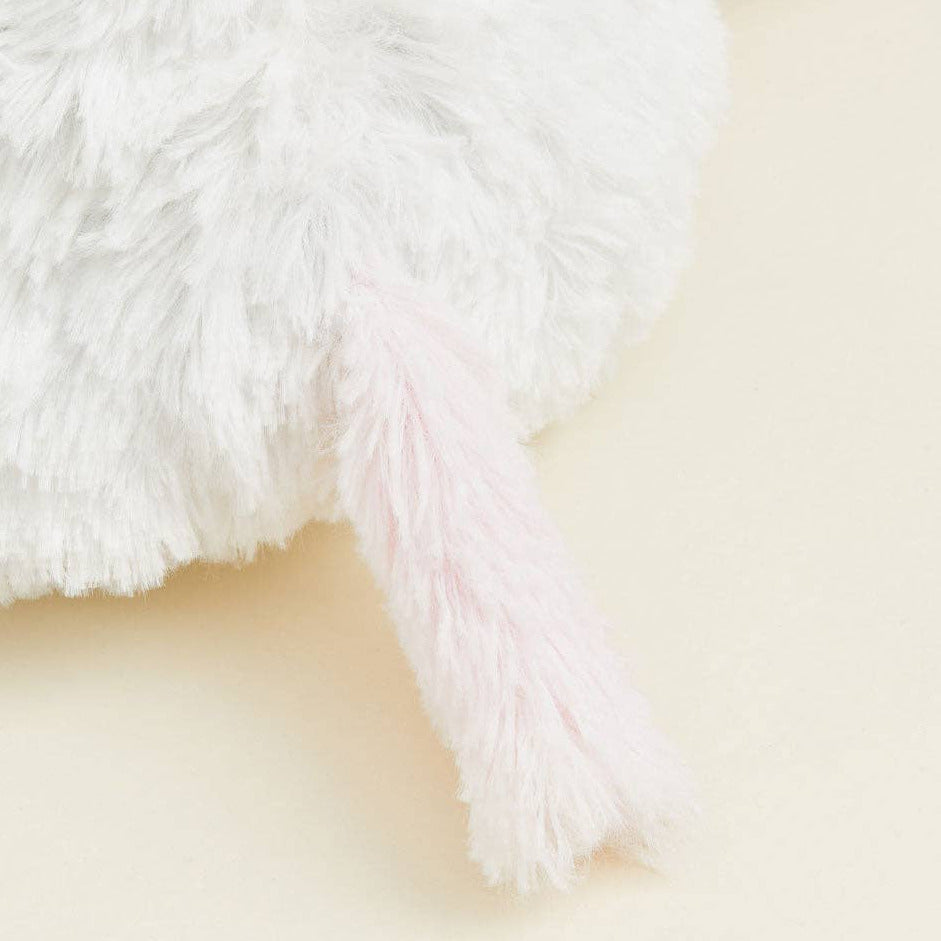 Close-up of a fluffy white surface on a light beige background