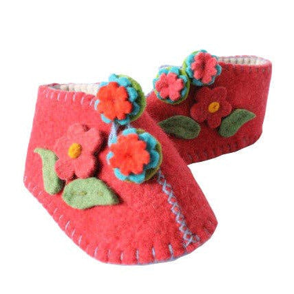 Red baby shoes with floral designs on a white background