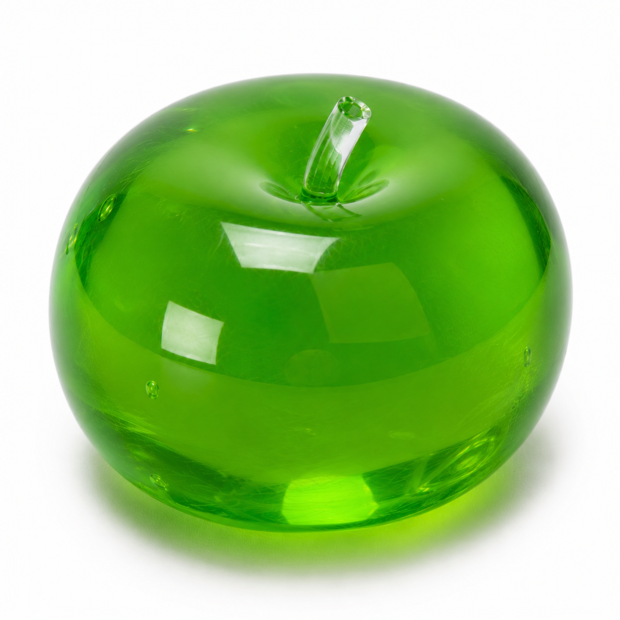Green glass apple on a white background