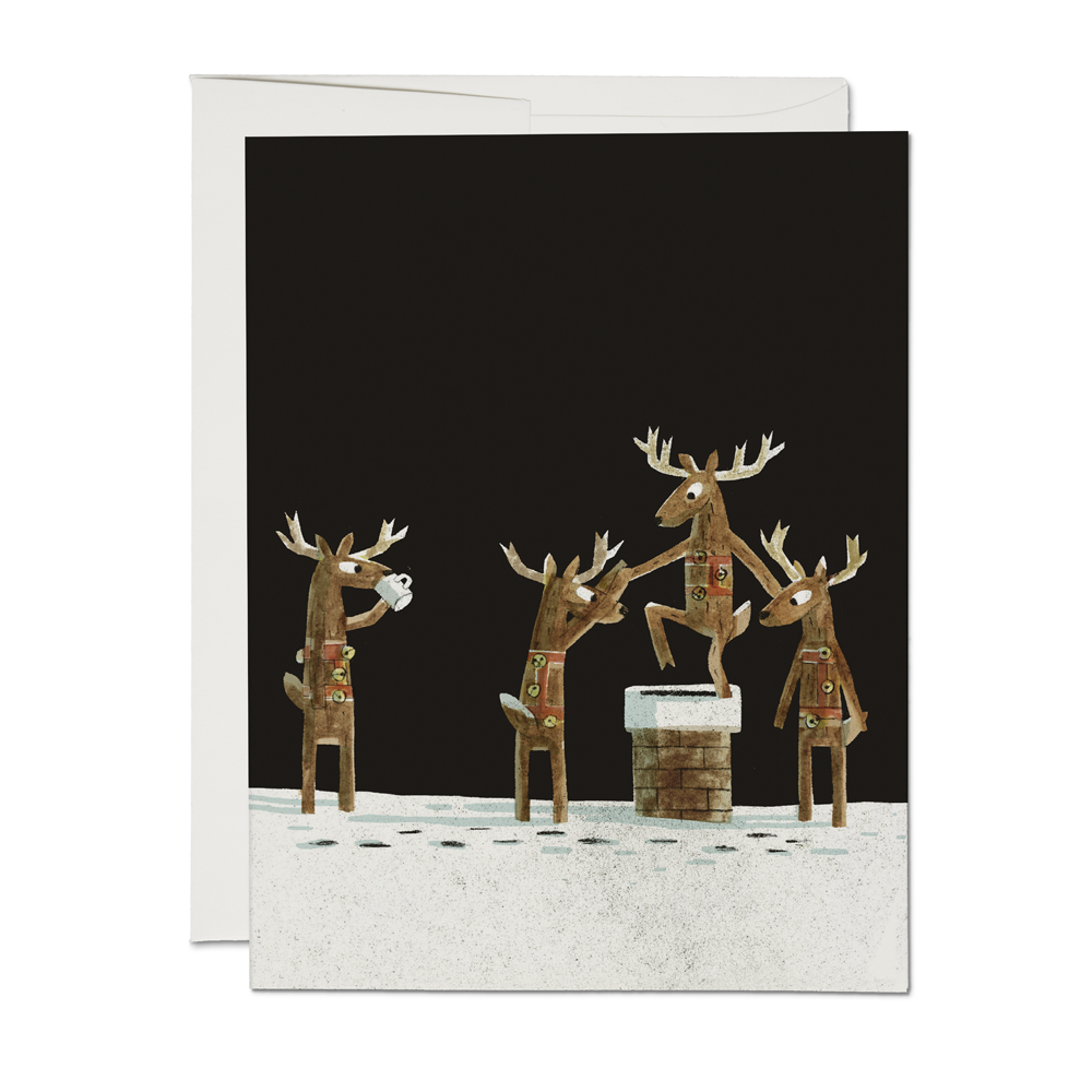 Greeting card with reindeer design on a black background