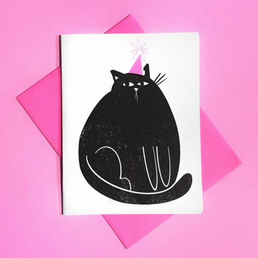Card with a black cat illustration on a pink background