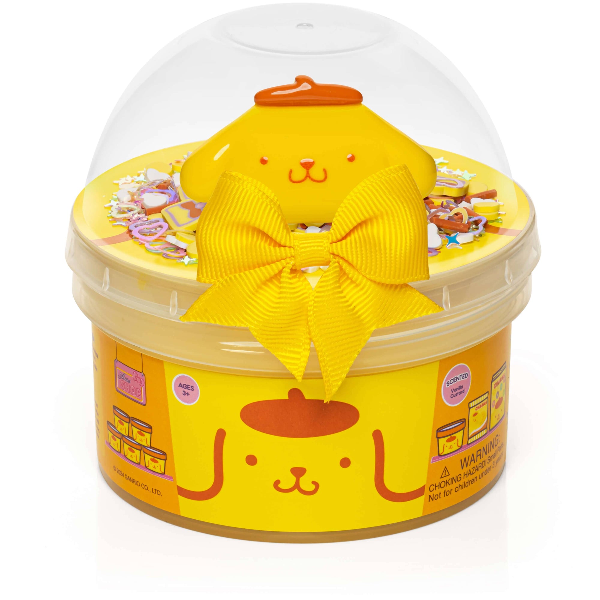Yellow dog character toy with a large bow in a clear dome on top of slime  on a white background