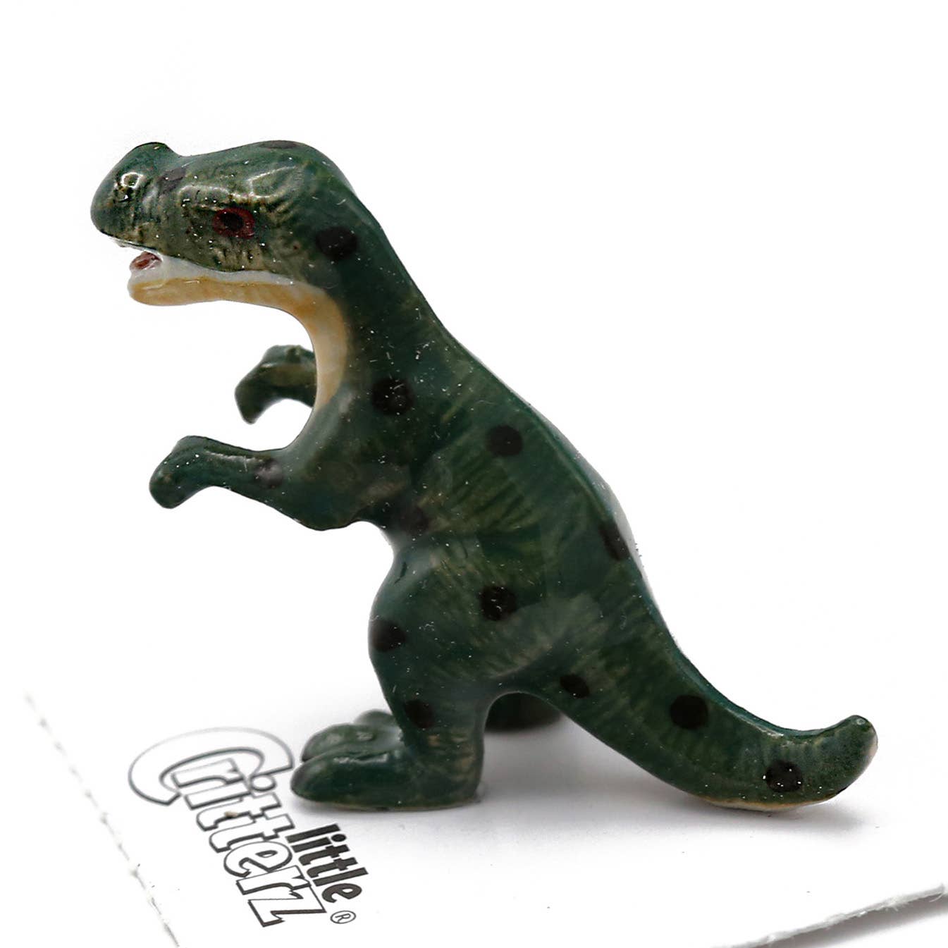 Toy dinosaur figure on a white background with 'Gizmo's' branding.