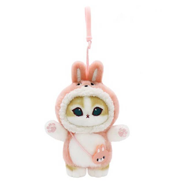 Plush keychain of a cat in a pink bunny costume on a white background