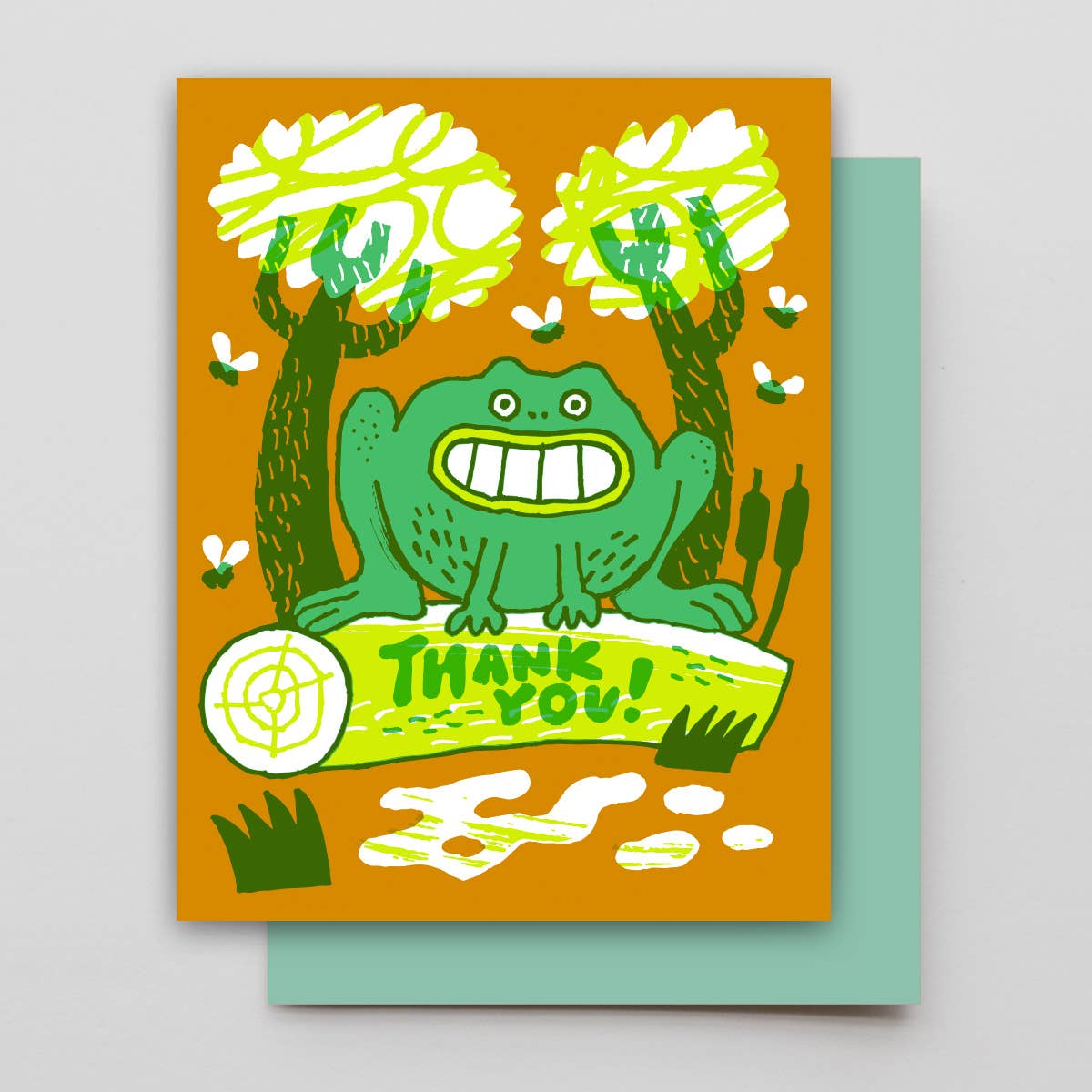Greeting card with a cartoon frog sitting on a log that says 'Thank You!' against an orange background.