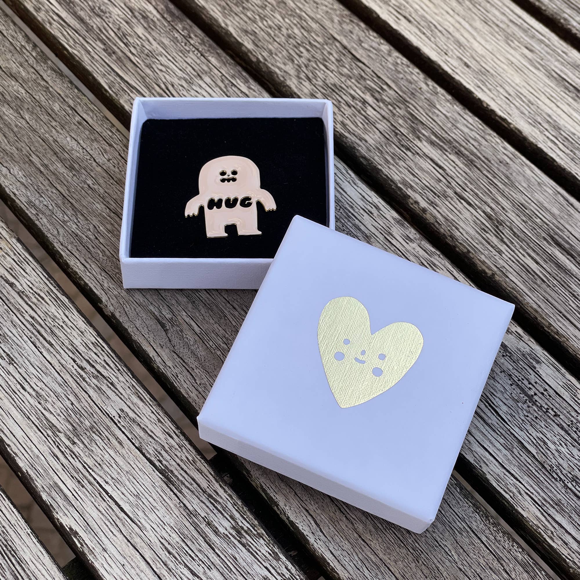 HUG enamel pin x Suzy Ultman