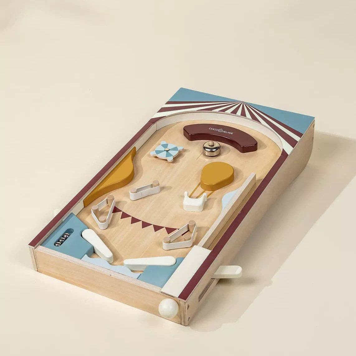 Wooden toy set with various shapes and a box on a beige background