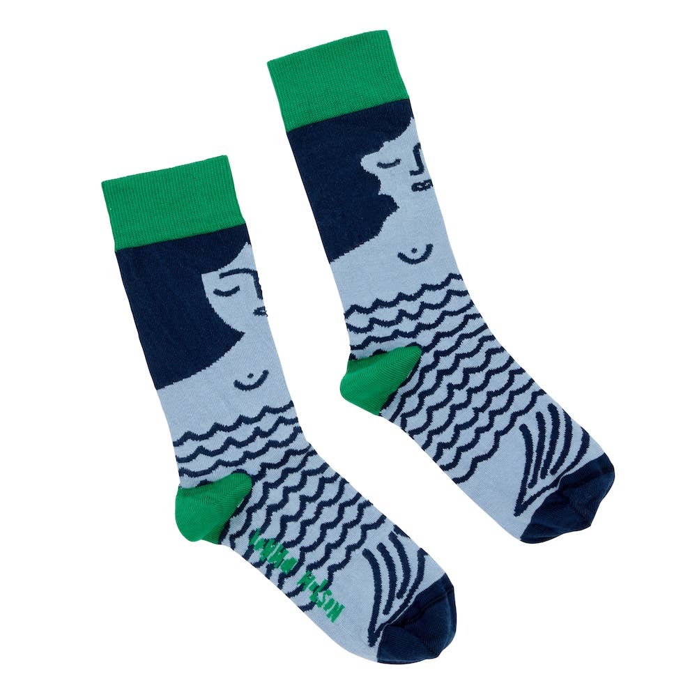 Pair of socks with a design of a person and wavy lines on a light blue background, with green accents.