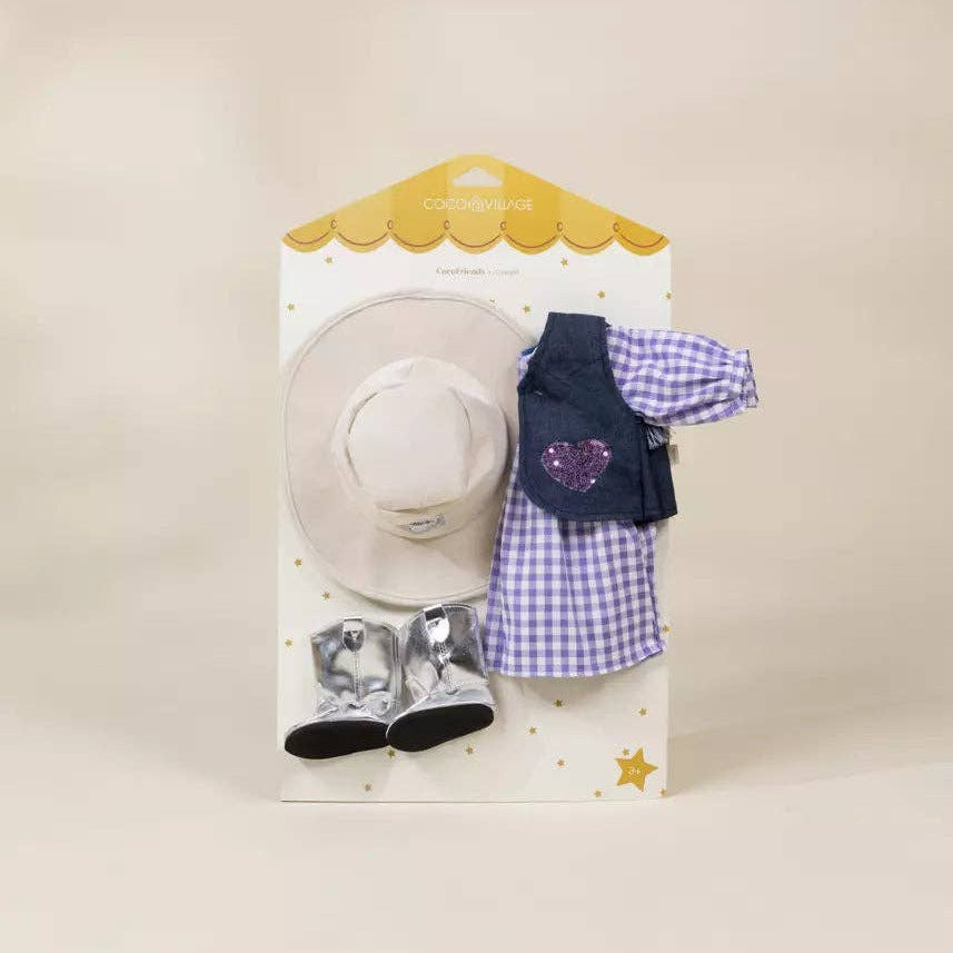 A doll or pet outfit set in its original packaging, featuring a white cowboy hat, a purple and white gingham dress, a navy vest with a purple heart, and silver boots on a cream background.