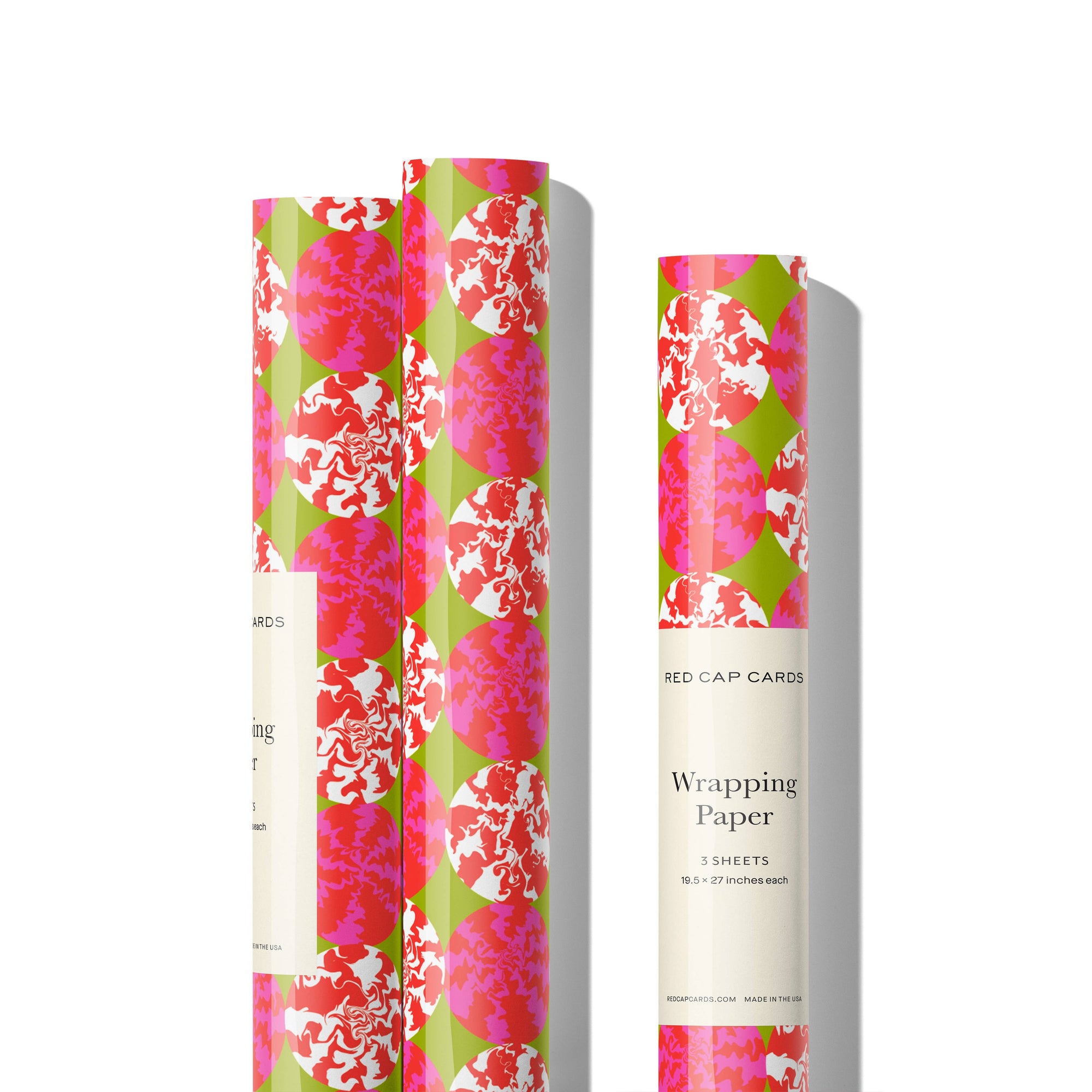 Floral wrapping paper with 'Red Cap Cards' branding on a white background