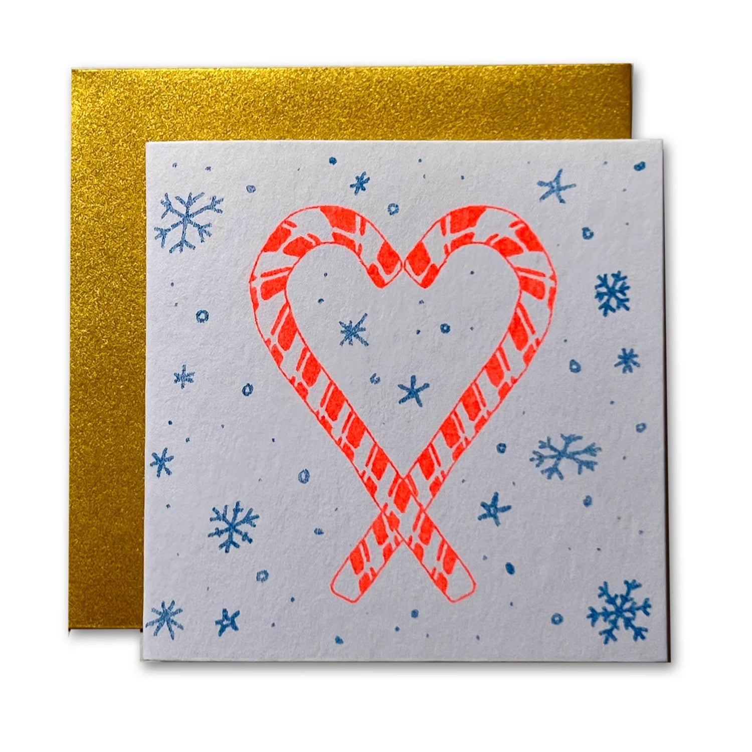 Card with candy cane hearts and snowflakes on a gold envelope