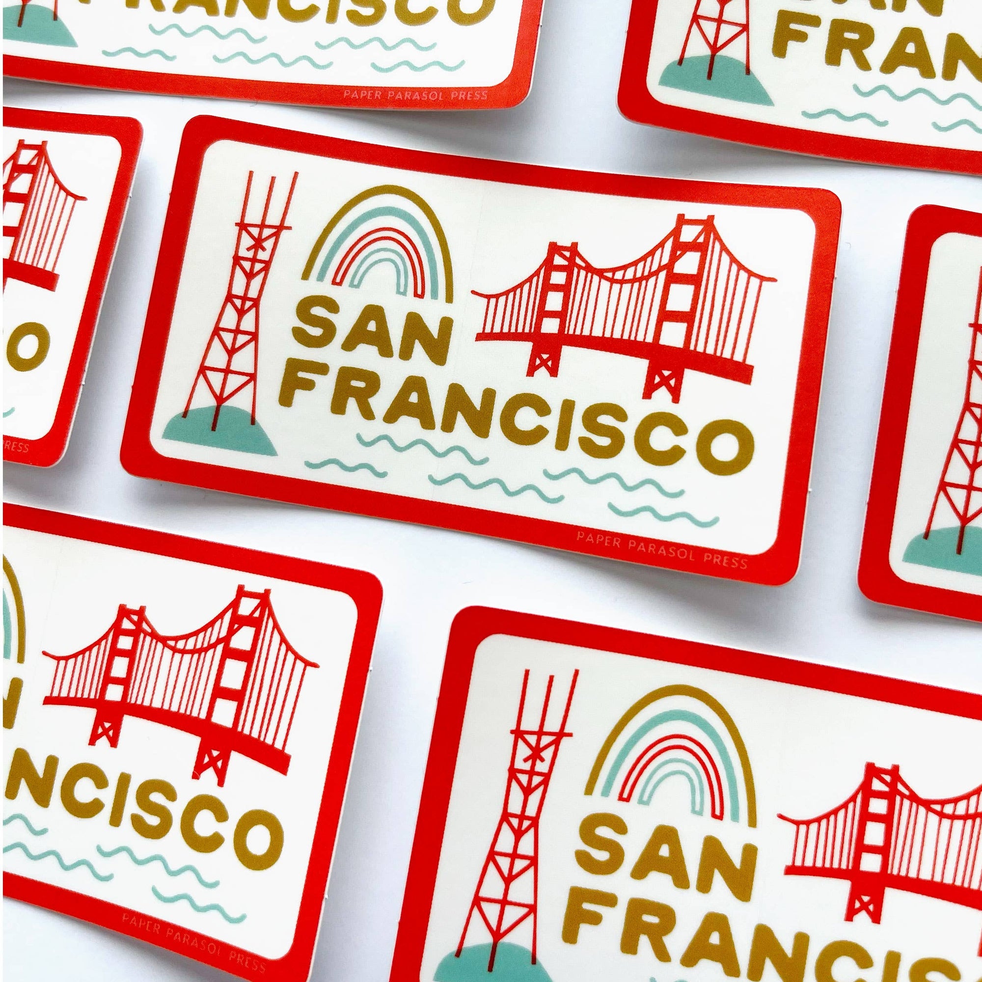 San Francisco-themed stickers with the Golden Gate Bridge and rainbow design on a white background.