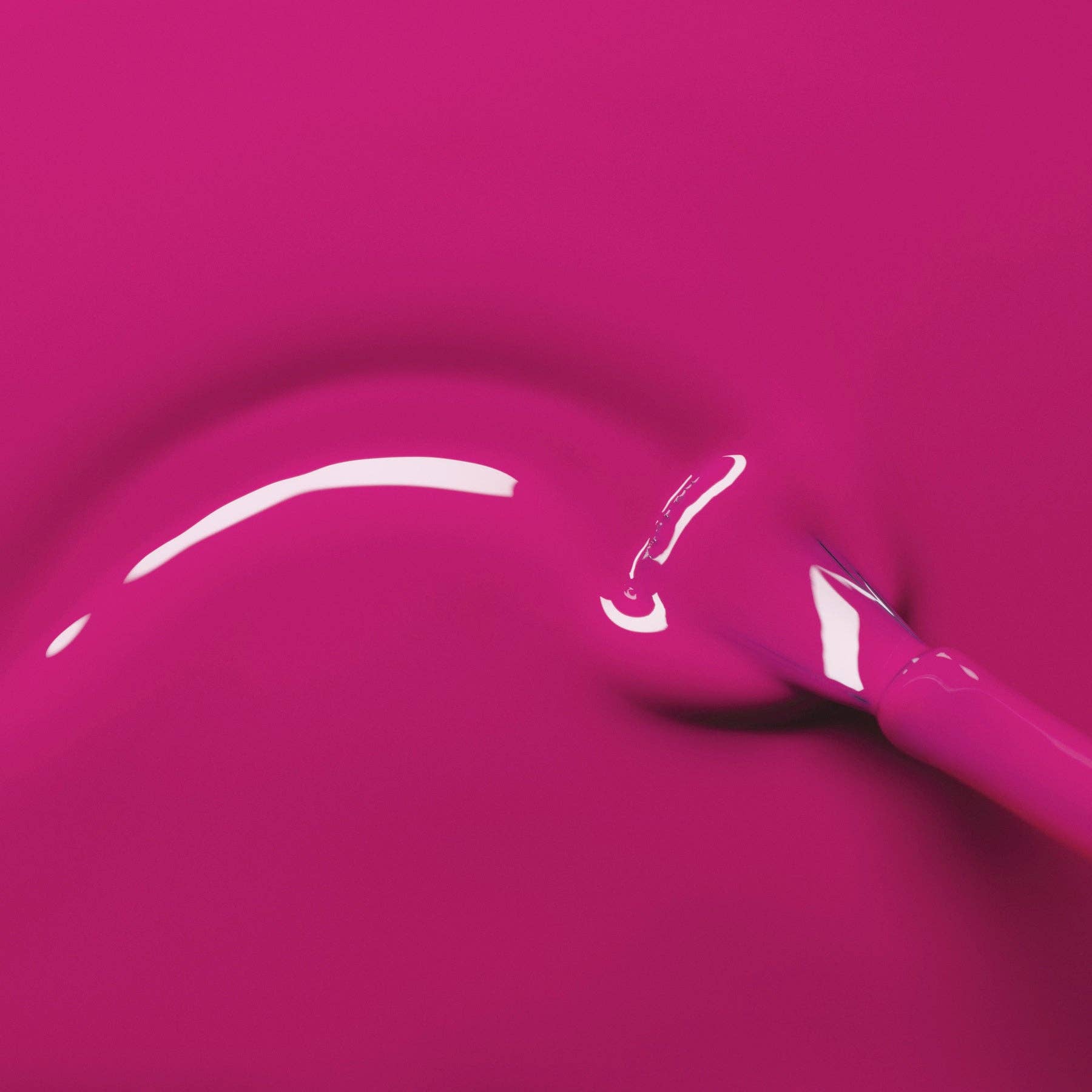 Pink lip gloss with applicator on a pink background