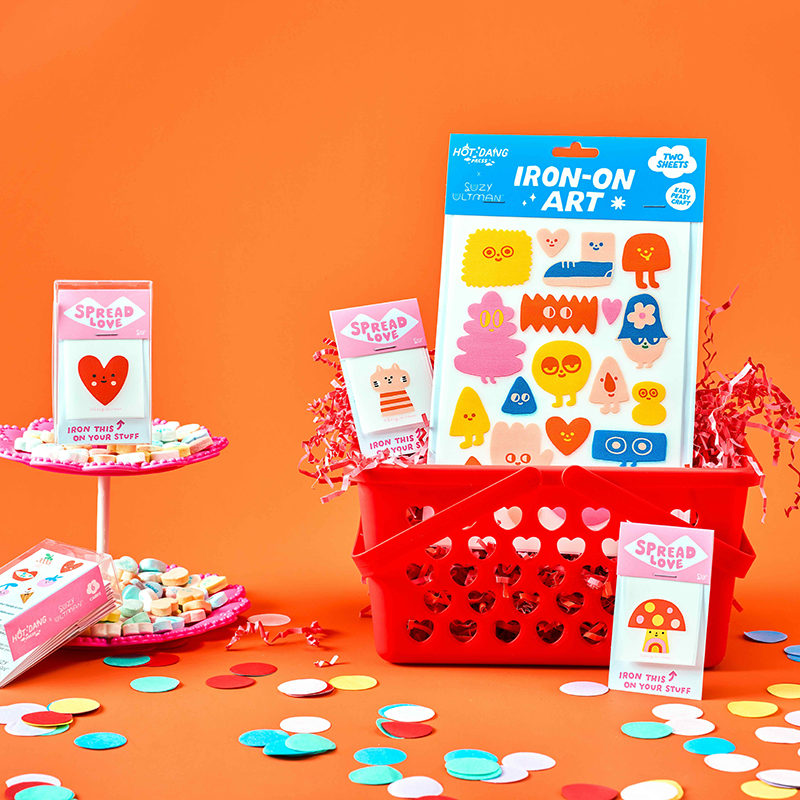 Iron-on art kit with colorful stickers on an orange background