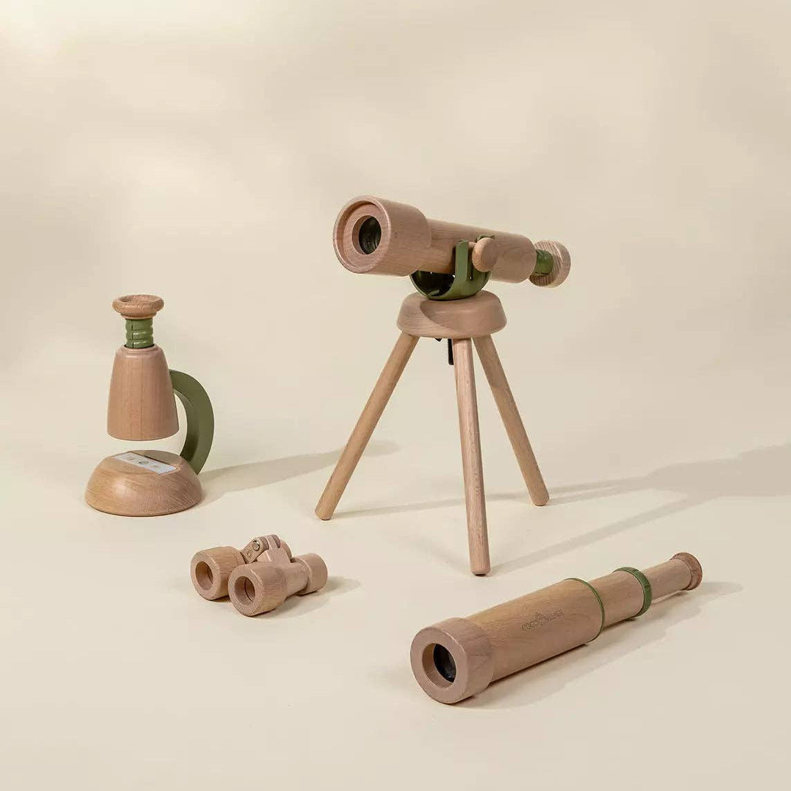 Set of WOOD telescopes and binoculars on a beige background