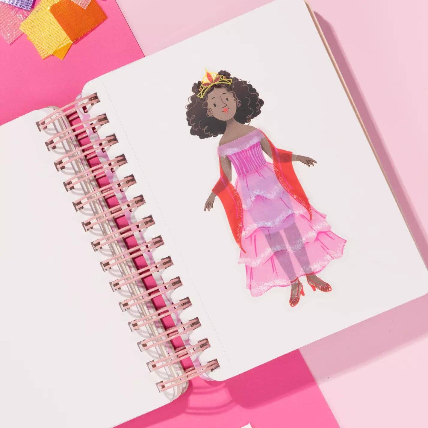 Notebook with a colorful illustration of a princess on a pink background