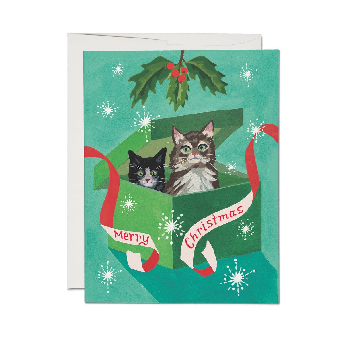 Christmas card with two cats in a gift box and holly leaves.
