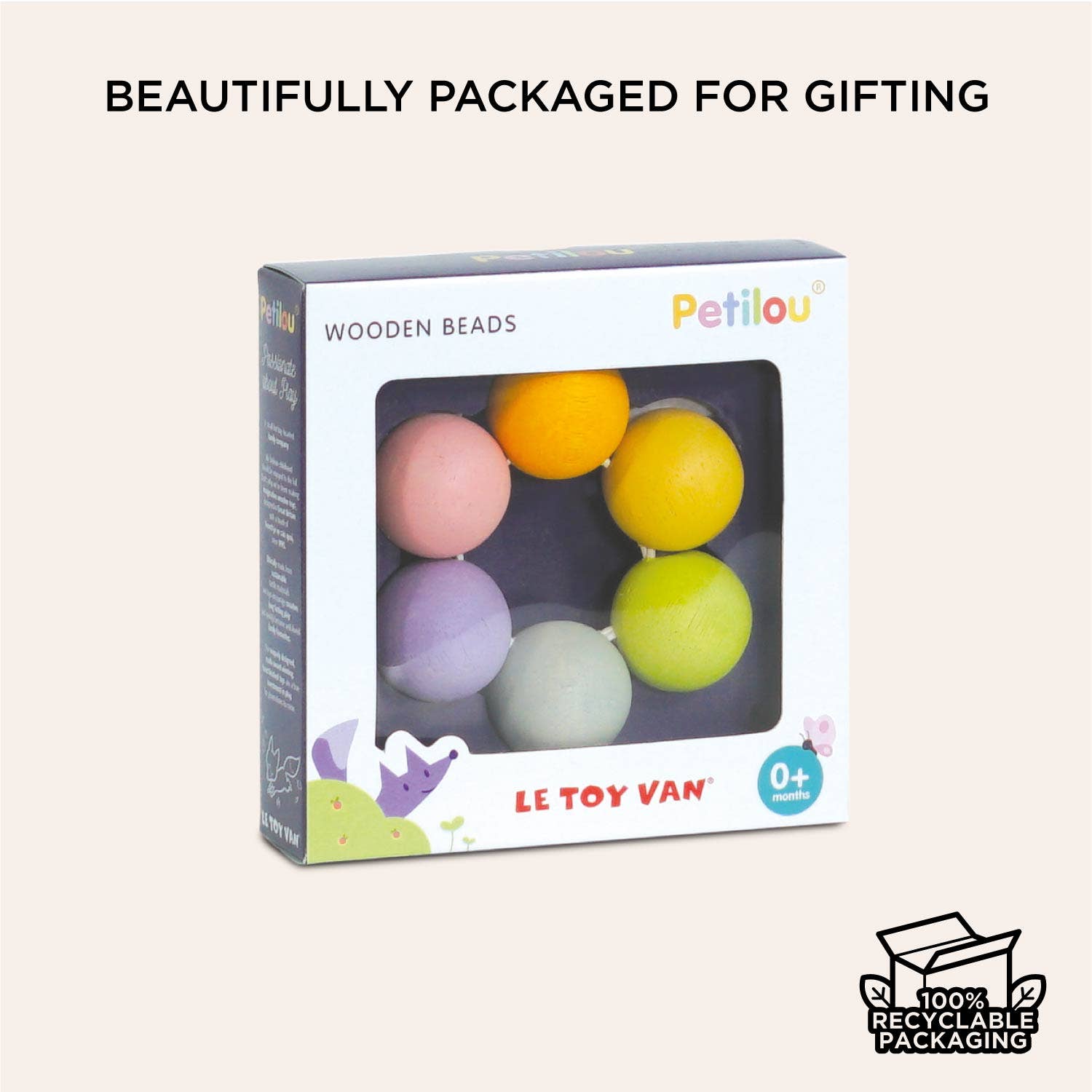 Packaged wooden beads with colorful balls and 'Petilou' branding on a light beige background.