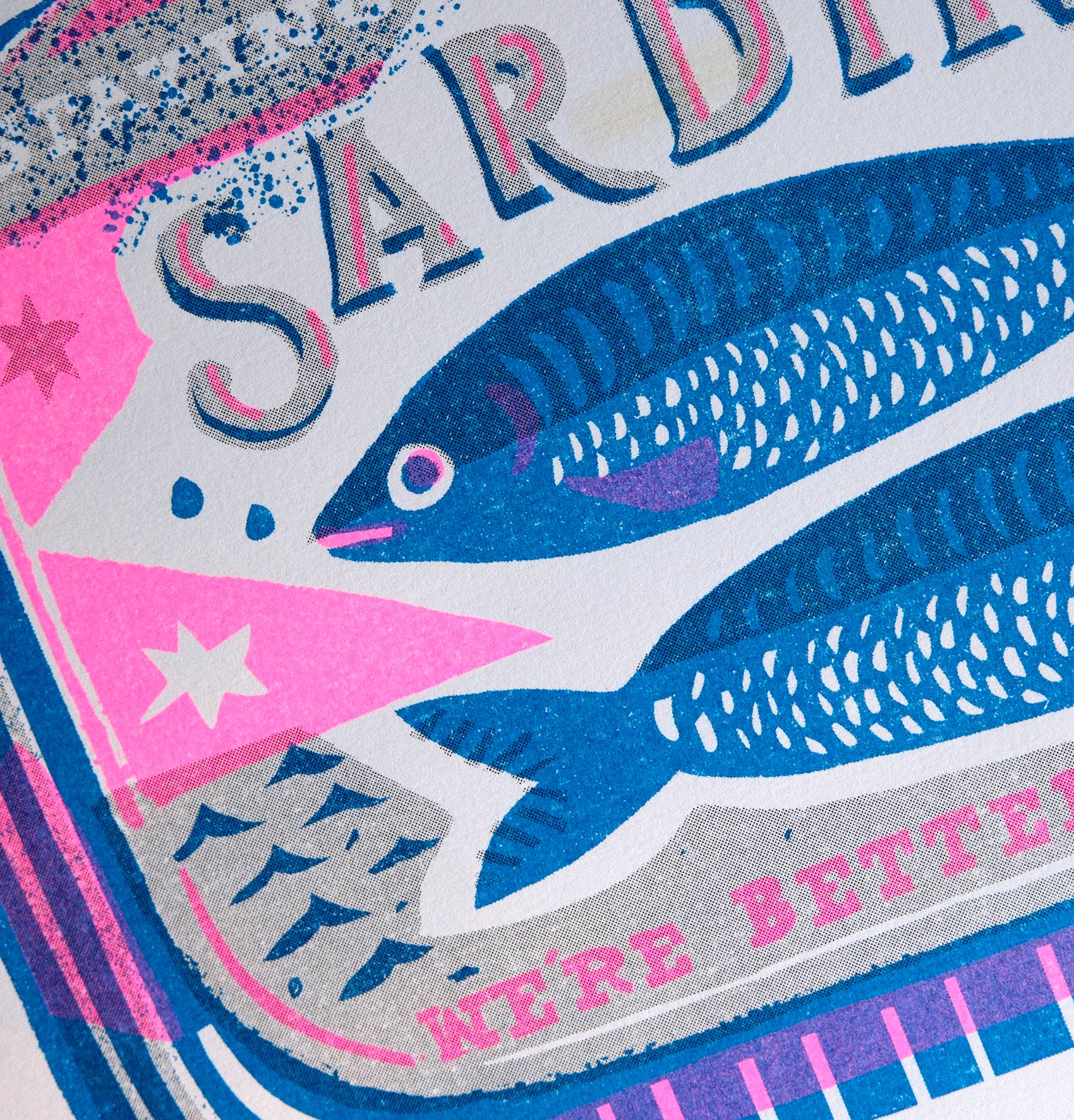 Close-up of a colorful label with fish illustration and text