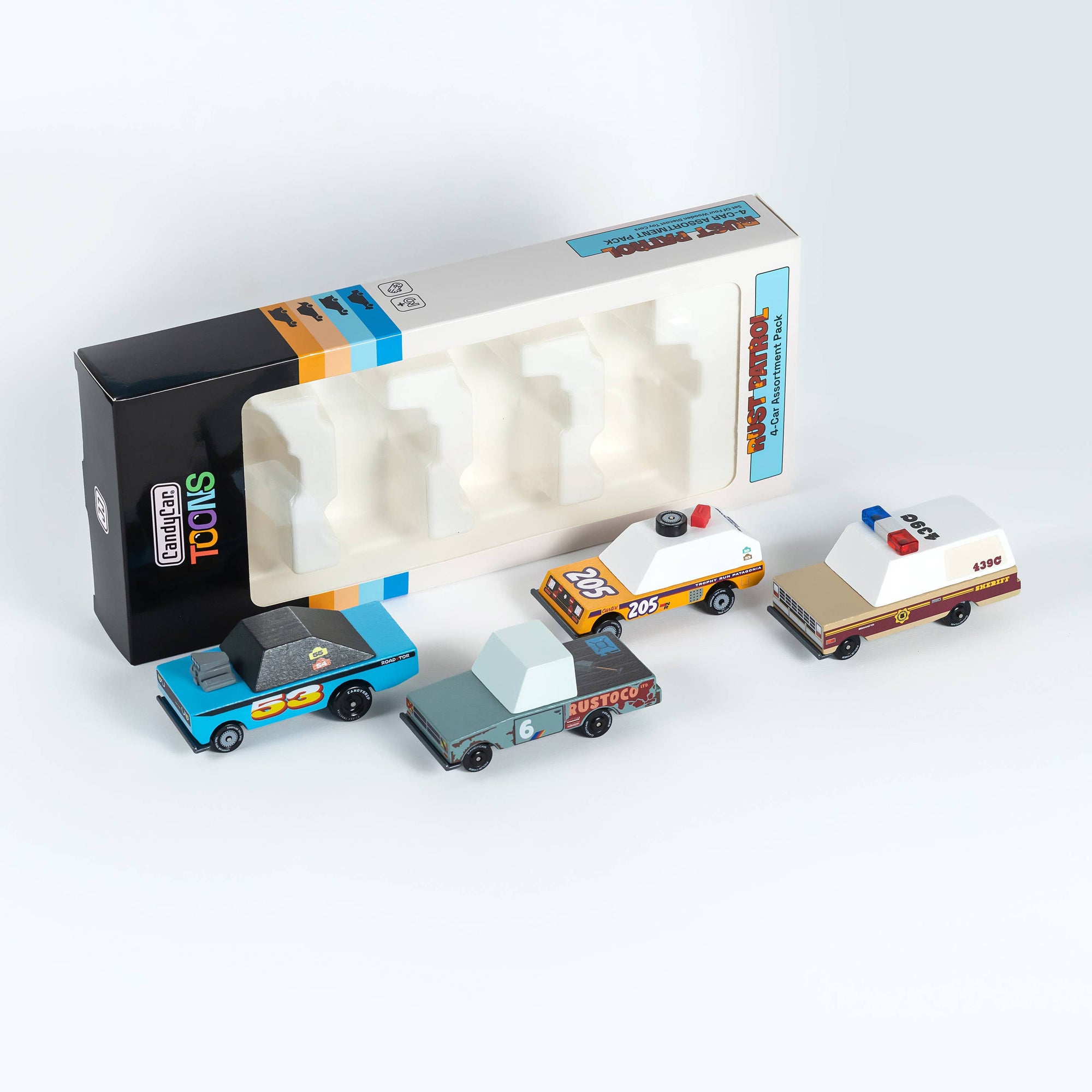 Set of toy cars with a packaging box on a white background