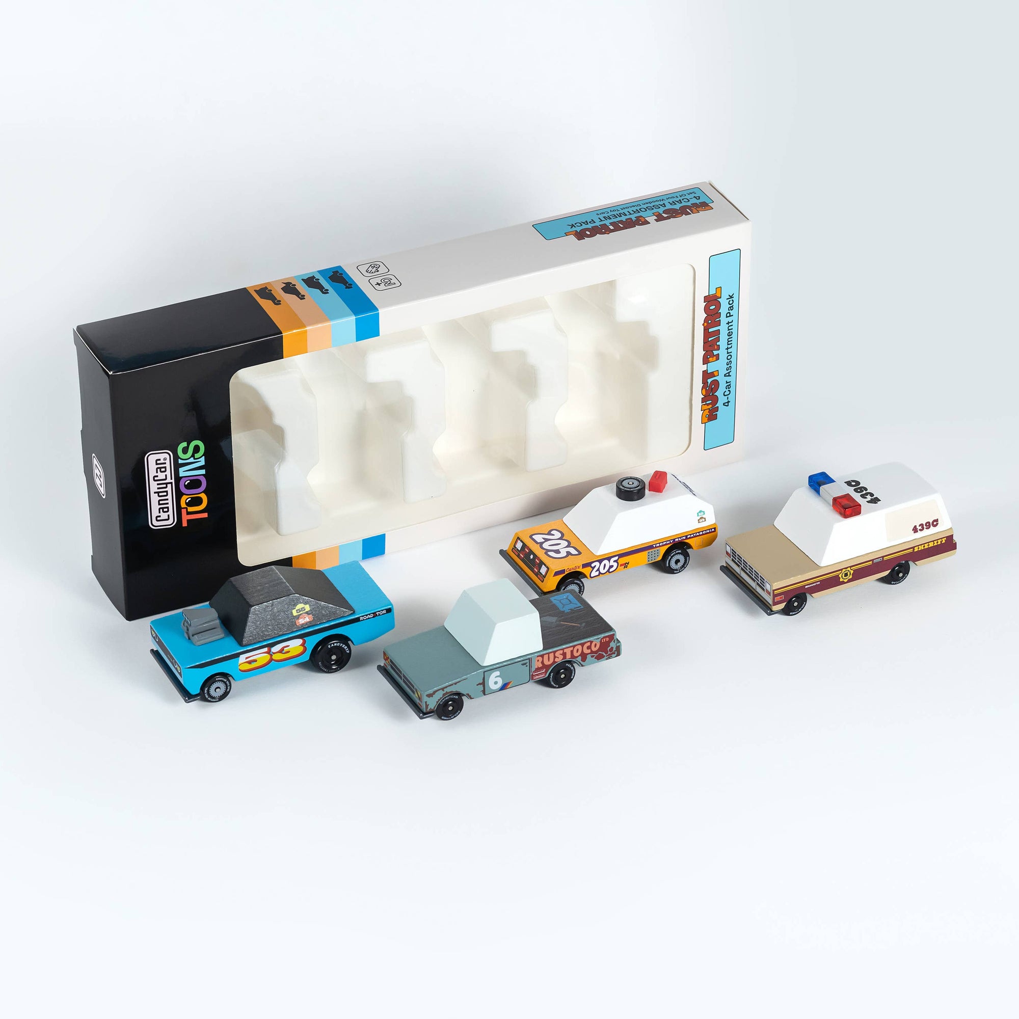 Set of toy cars with a packaging box on a white background