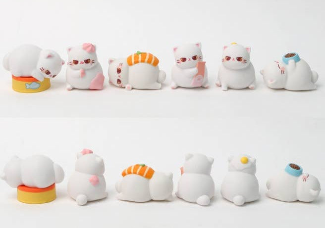 Set of cute cat-shaped figurines with various accessories on a white background