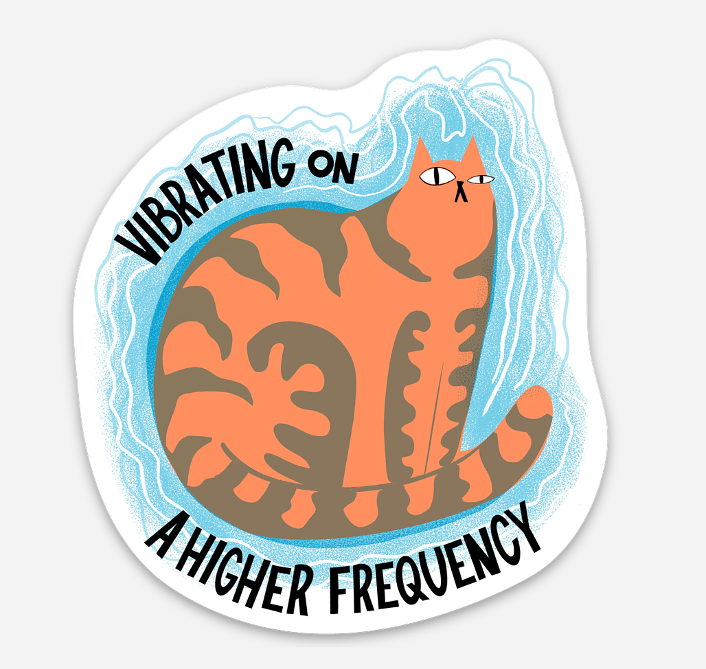 Sticker with a cat illustration and text 'Vibrating on a Higher Frequency' on a white background
