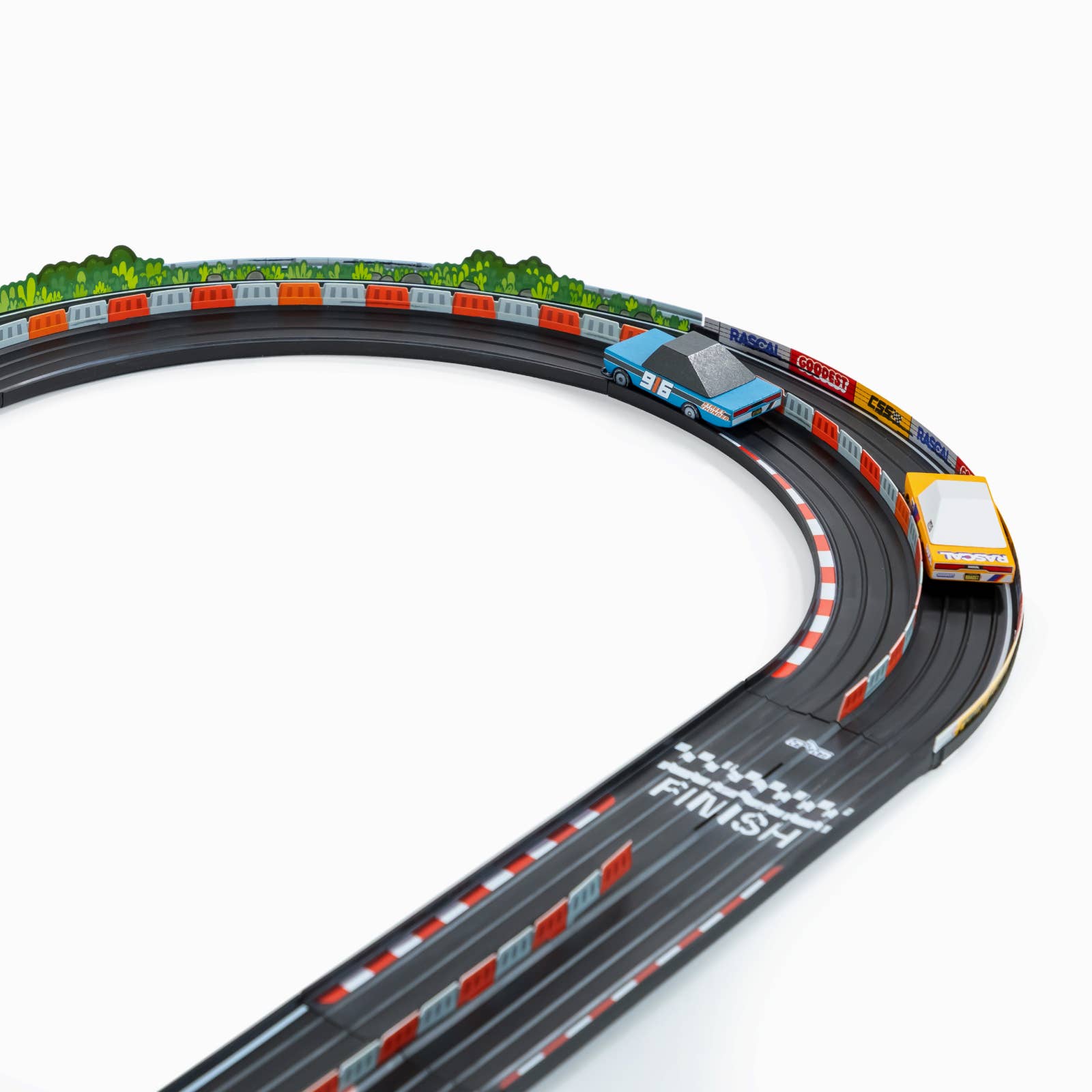 Toy race track set with cars on a white background