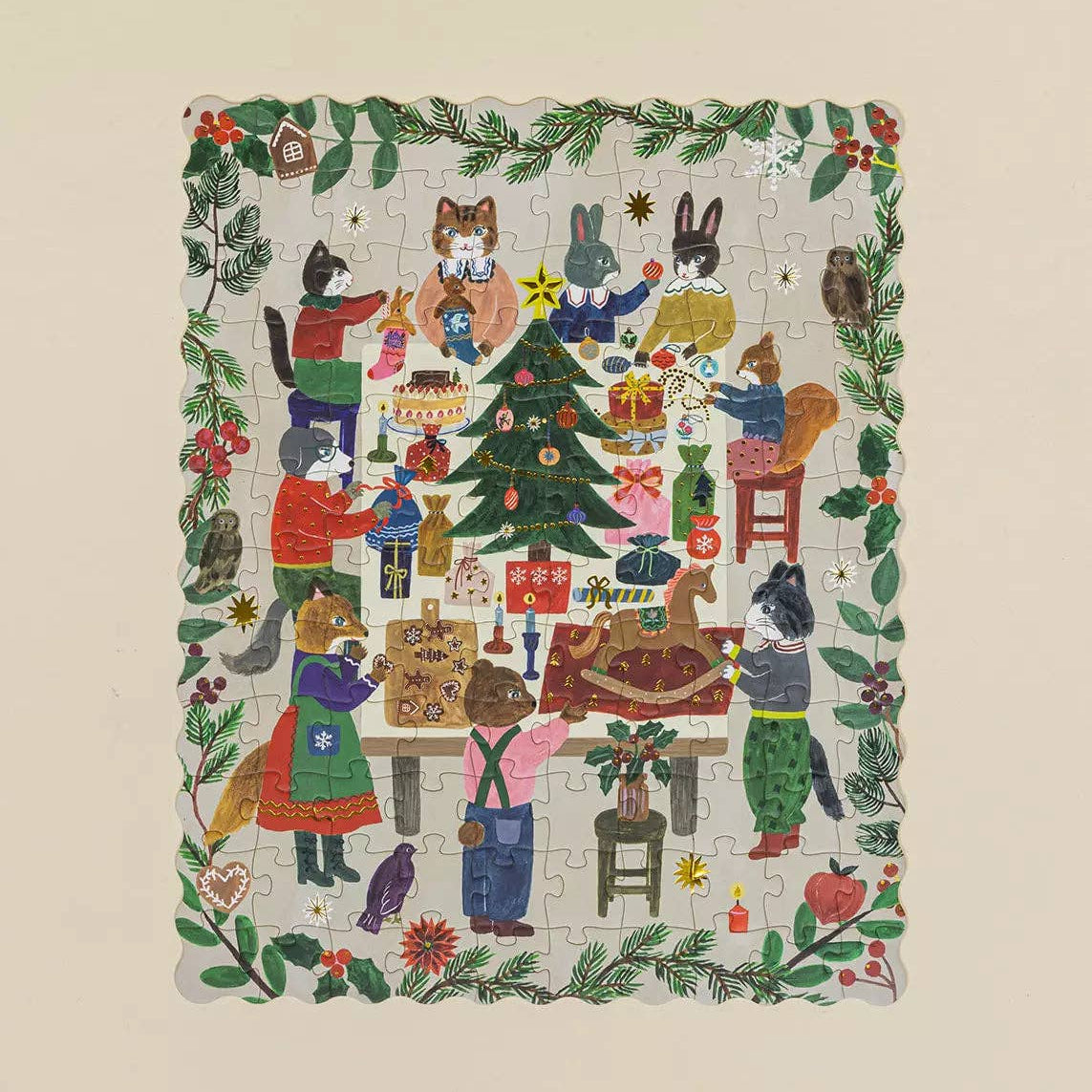 Jigsaw puzzle with festive design of animals around a Christmas tree on a beige background