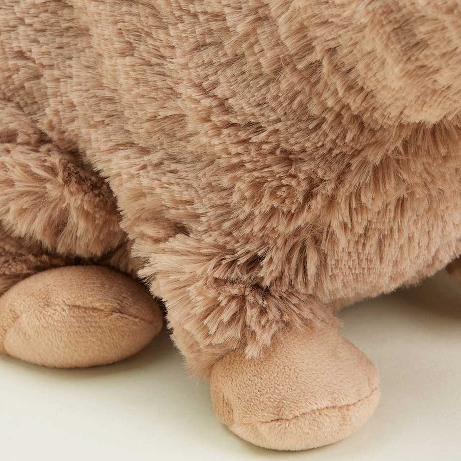 Close-up of a brown plush toy on a white background
