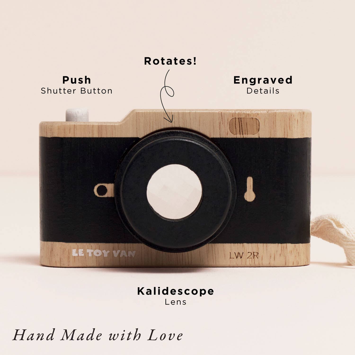 Wooden toy camera with engraved details and Kalidescope lens, labeled features on a beige background.