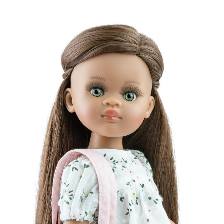 Doll with a floral dress and pink bag on a white background