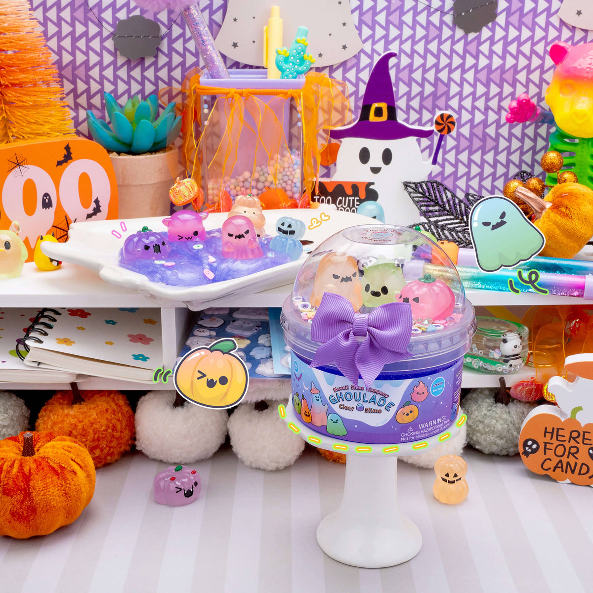 Decorative setup with Halloween-themed items, including a container of small plush toys and festive decorations.