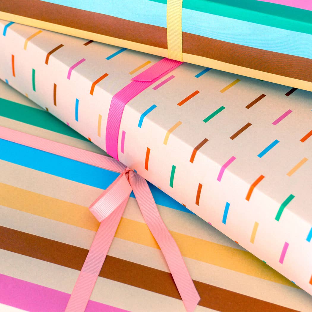 Colorful gift wrap with ribbons on a light background